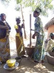Teenagers pounding Millet